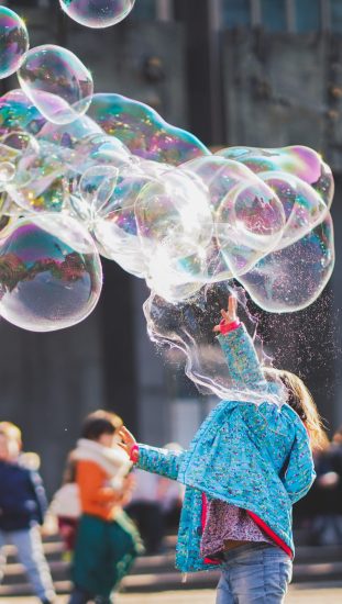 girl-playing-with-bubbles-1919030