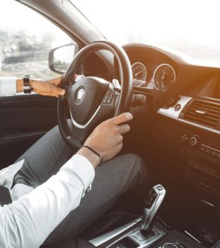 man-in-white-dress-shirt-holding-steering-wheel-804130